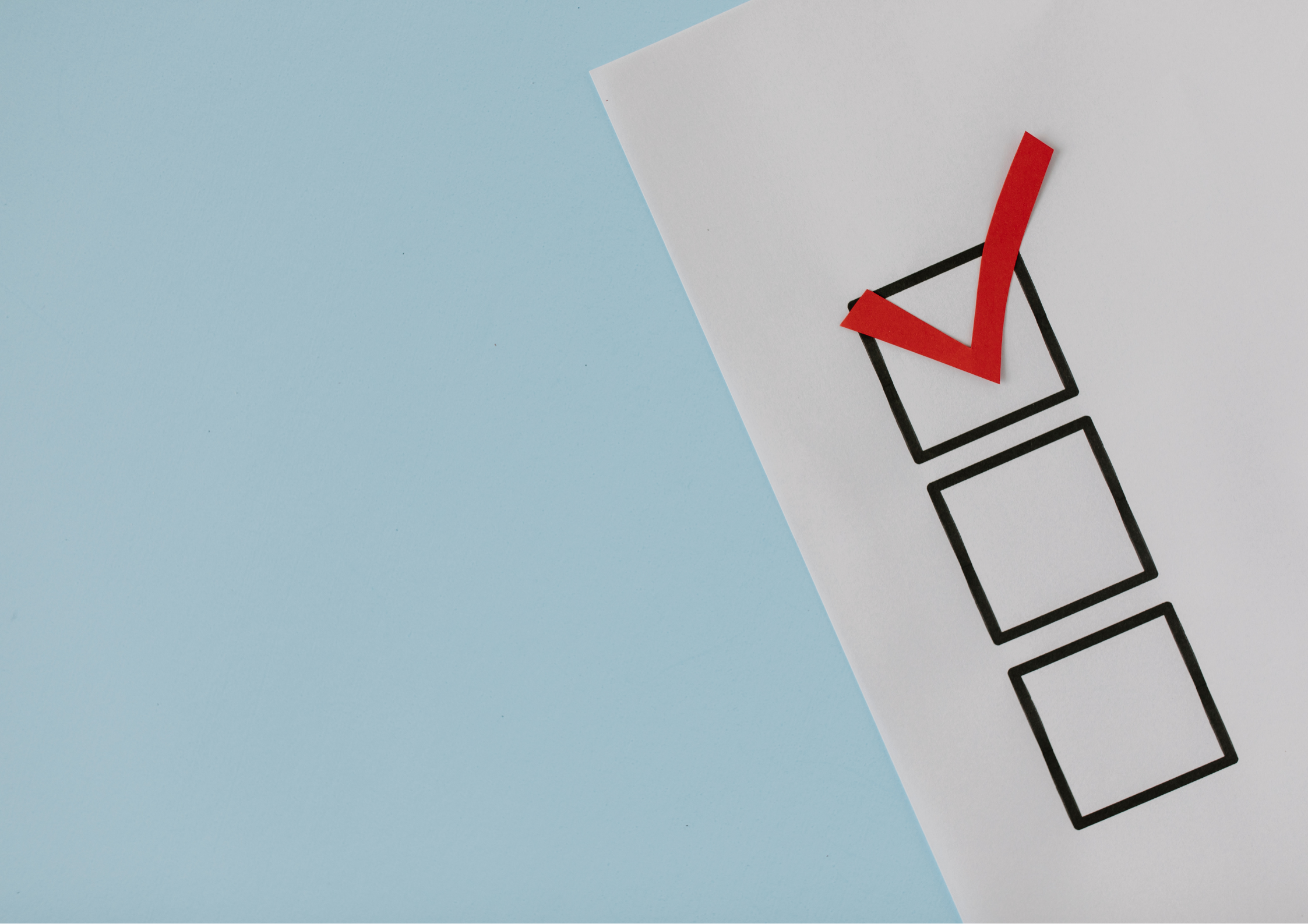 White checklist on blue background. Large red tick in first black outlined checkbox.