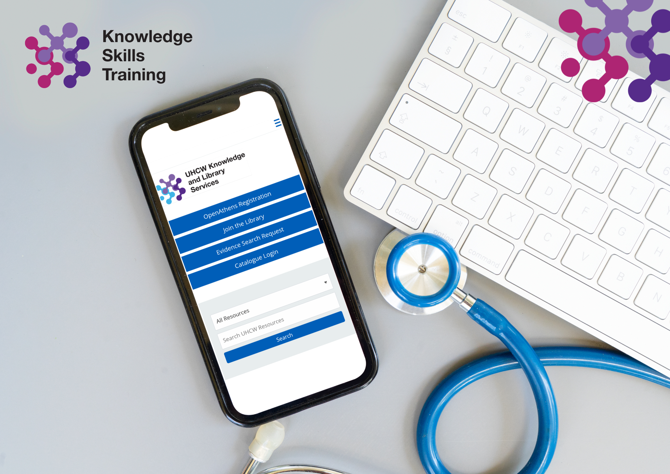 Image of a stethscope, keyboard and mobile phone, displaying the mobile version of the library website.